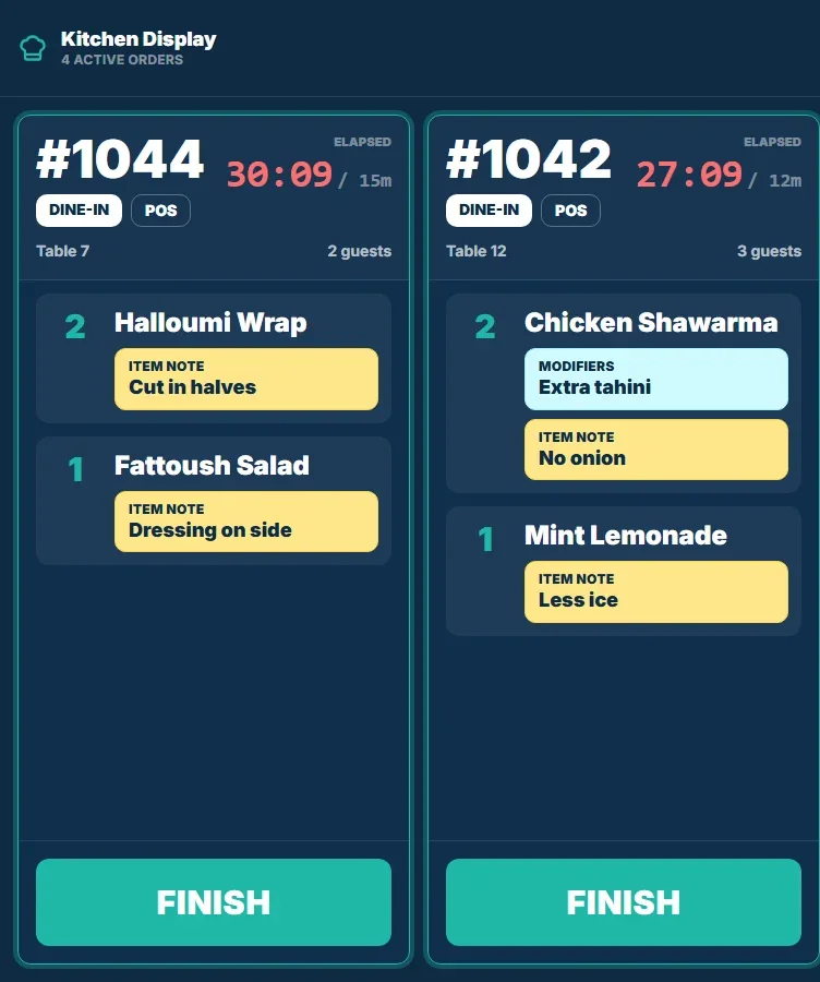 Kitchen display with two dine-in tickets, modifiers, item notes and elapsed timers