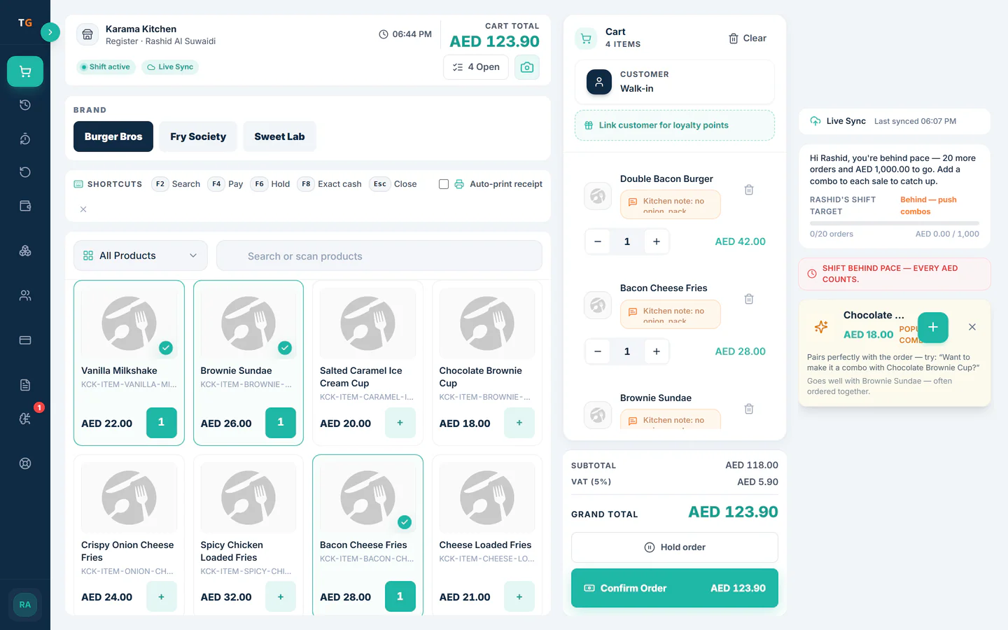 TajerGo POS till with several items in the cart, kitchen notes, subtotal, VAT 5% and the grand total, Karama Cloud Kitchen demo tenant